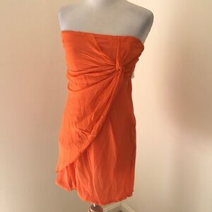 NWOT! MM Couture medium orange strapless twisted front dress.